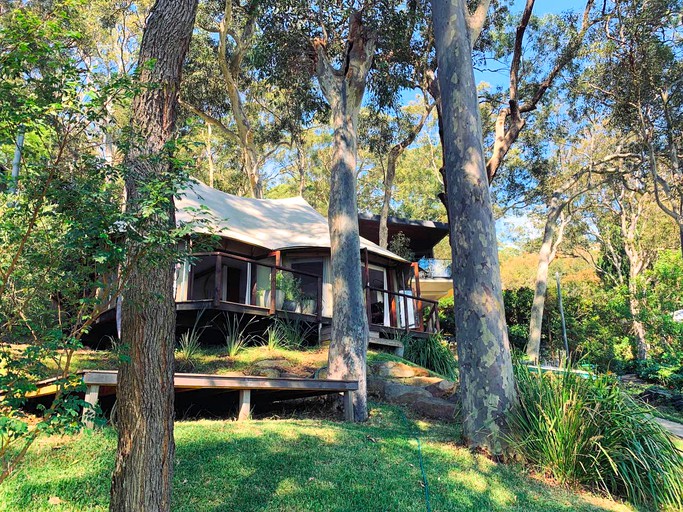 This unique rental surrounded by trees and with views of Pittwater is perfect for glamping near Sydney, NSW