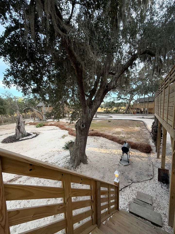 Marsh-View Treehouse Tent Glamping with Private Campsite, Wildlife Watching, BBQ, Fire Pit in Townsend, Georgia