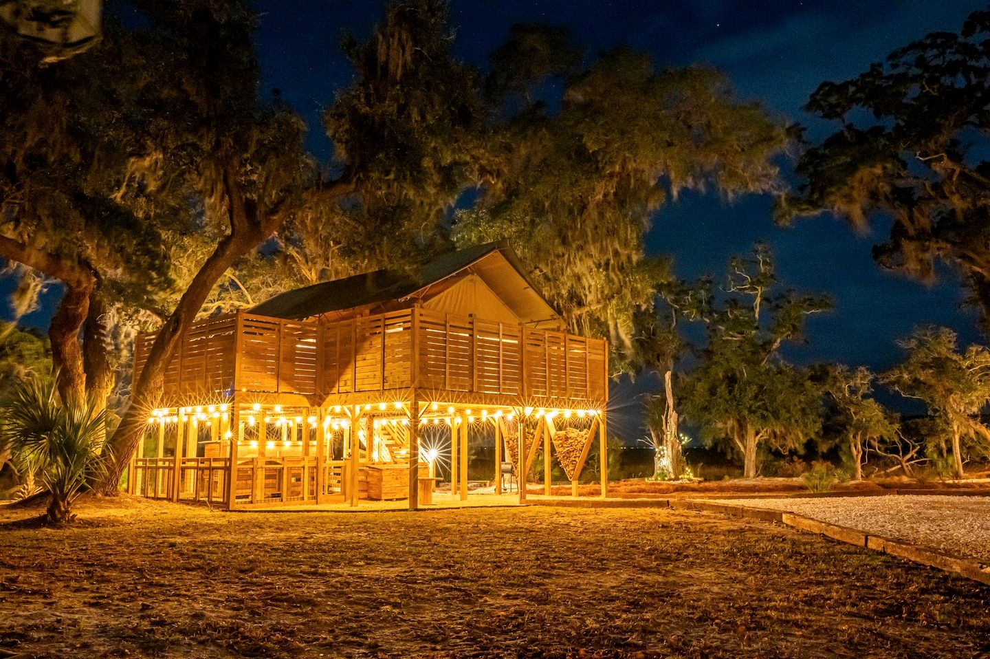 Marsh-View Treehouse Tent Glamping with Private Campsite, Wildlife Watching, BBQ, Fire Pit in Townsend, Georgia