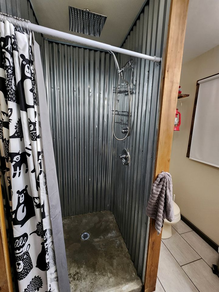 Secluded Luxury Cabin with Hot Tub on 10 Private Acres near Trails in Reed City, Michigan