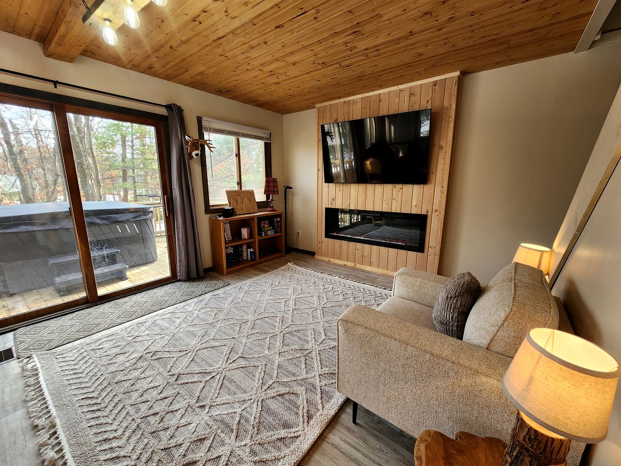 Secluded Luxury Cabin with Hot Tub on 10 Private Acres near Trails in Reed City, Michigan