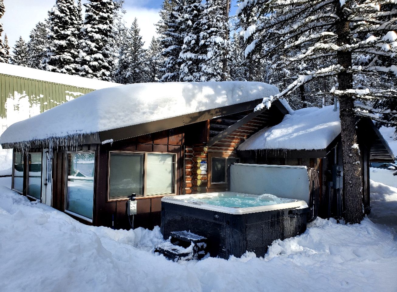 Charming Riverfront Cabin with Hot Tub and Dock Access Near Scenic Trails in Island Park, Idaho