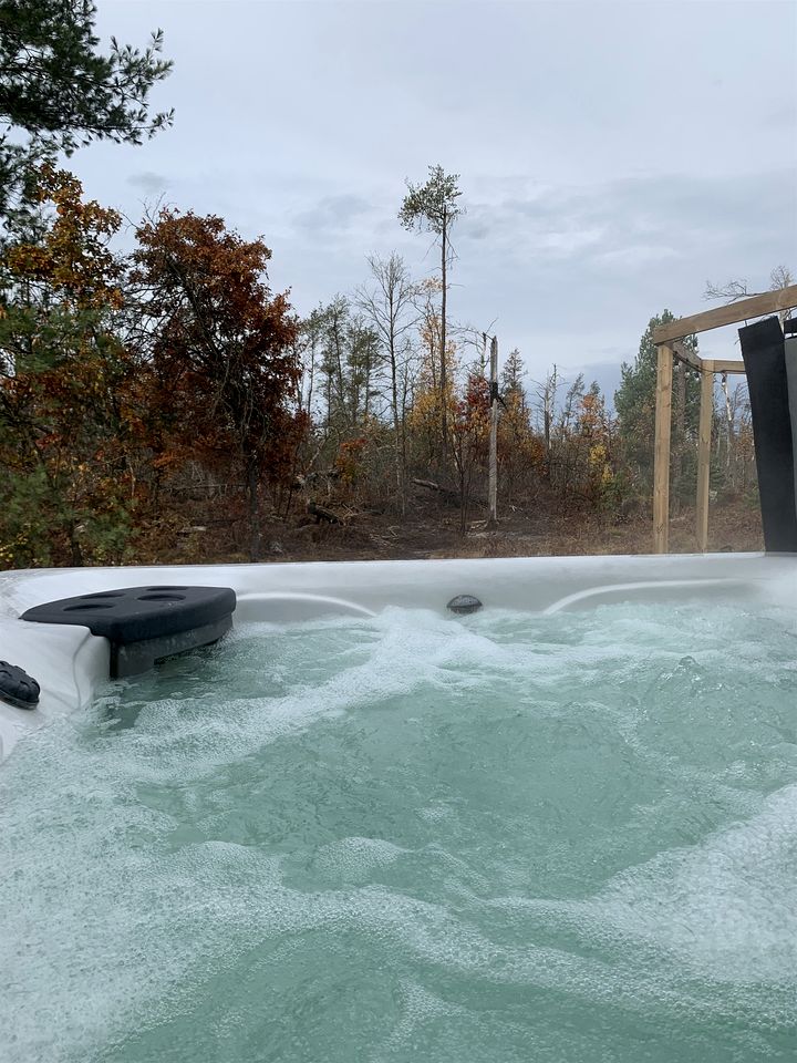 Secluded Rustic Cabin with Hot Tub Near Pere Marquette River in Big Rapids, Michigan