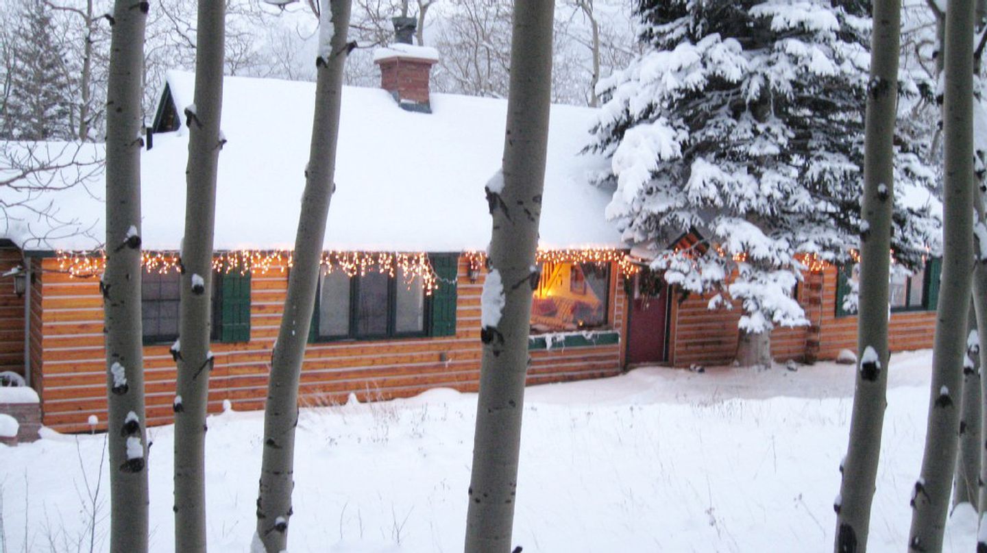 Forested Log Cabin Rental in Mountain Town for Weekend Trip from Denver