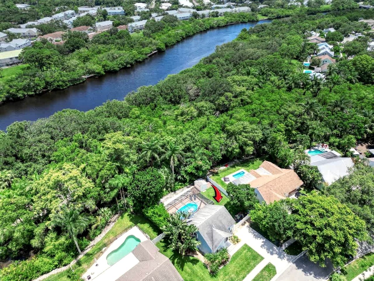 Serene Vacation Home with Screened Pool & River Access Near Beaches, Dining & Shopping in Jupiter, Florida