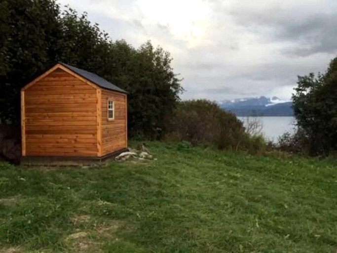 A tiny house rental in Homer, Alaska, looking out over the water.