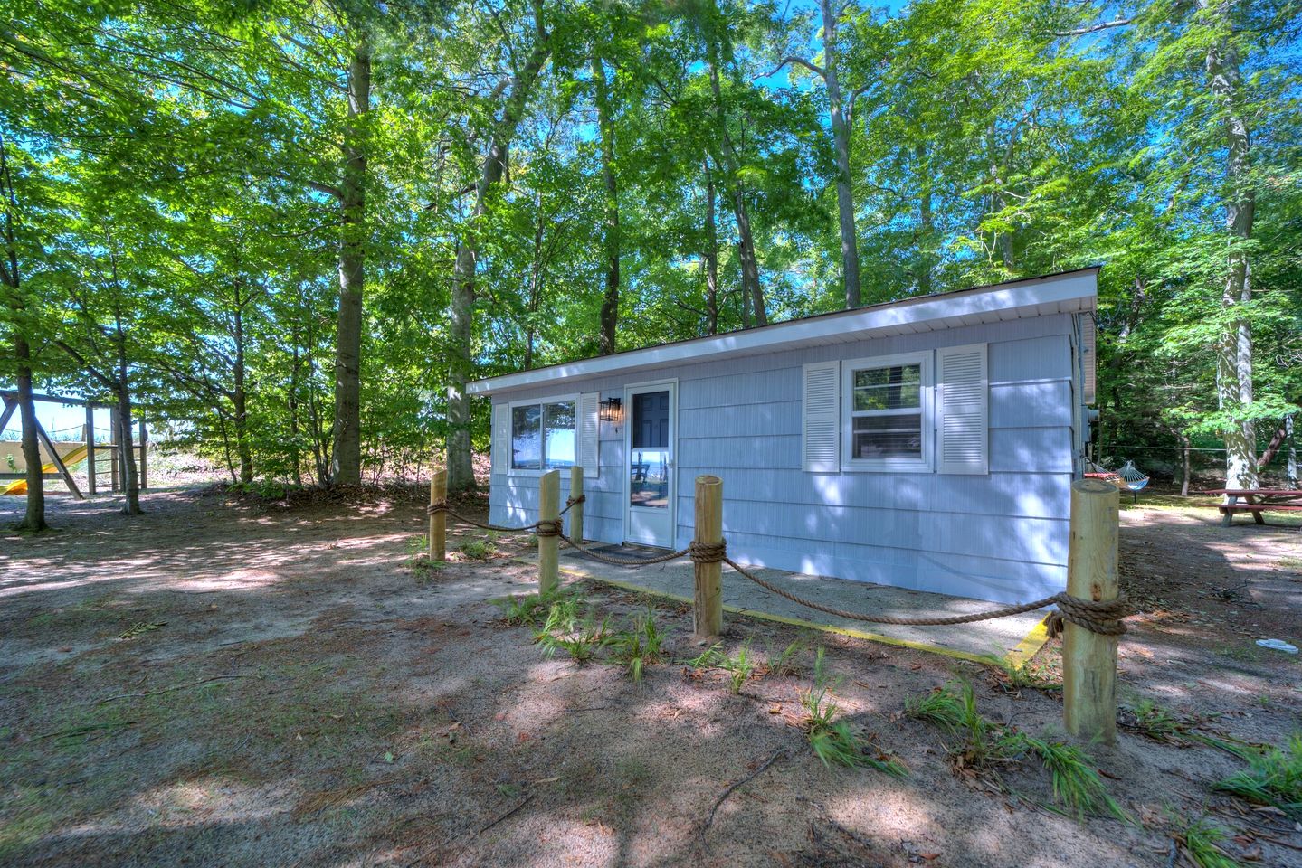 Lake Michigan Retreats in this Charming Cabin Rental with Fire-Pit