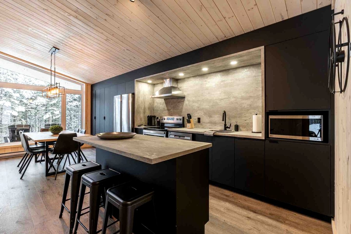 Secluded Forest Retreat with Stylish Interior in Domaine Charlevoix, Quebec