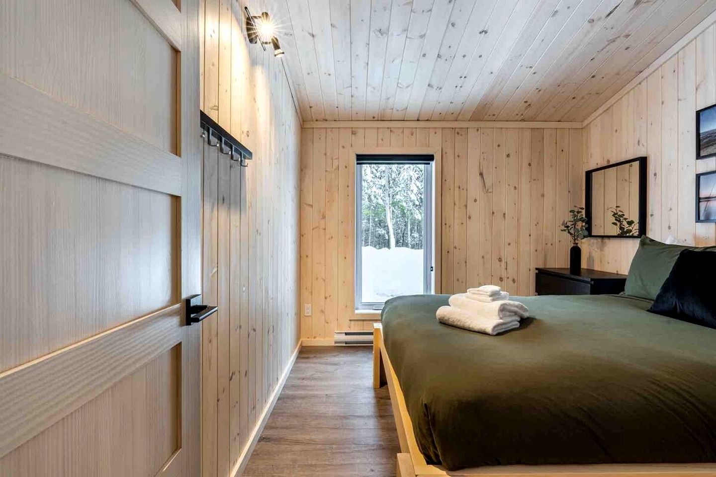 Secluded Forest Retreat with Stylish Interior in Domaine Charlevoix, Quebec