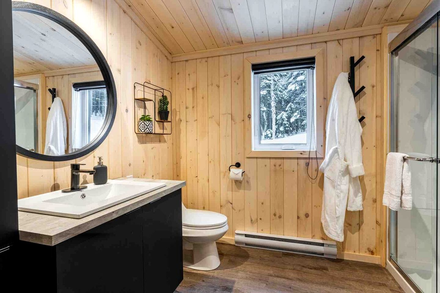 Secluded Forest Retreat with Stylish Interior in Domaine Charlevoix, Quebec