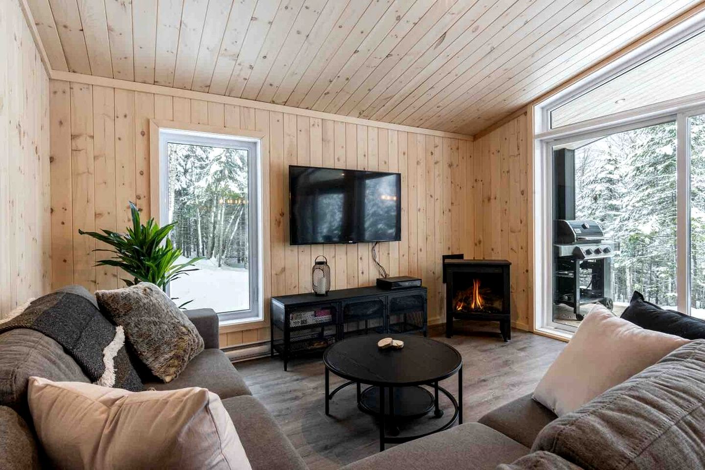 Secluded Forest Retreat with Stylish Interior in Domaine Charlevoix, Quebec