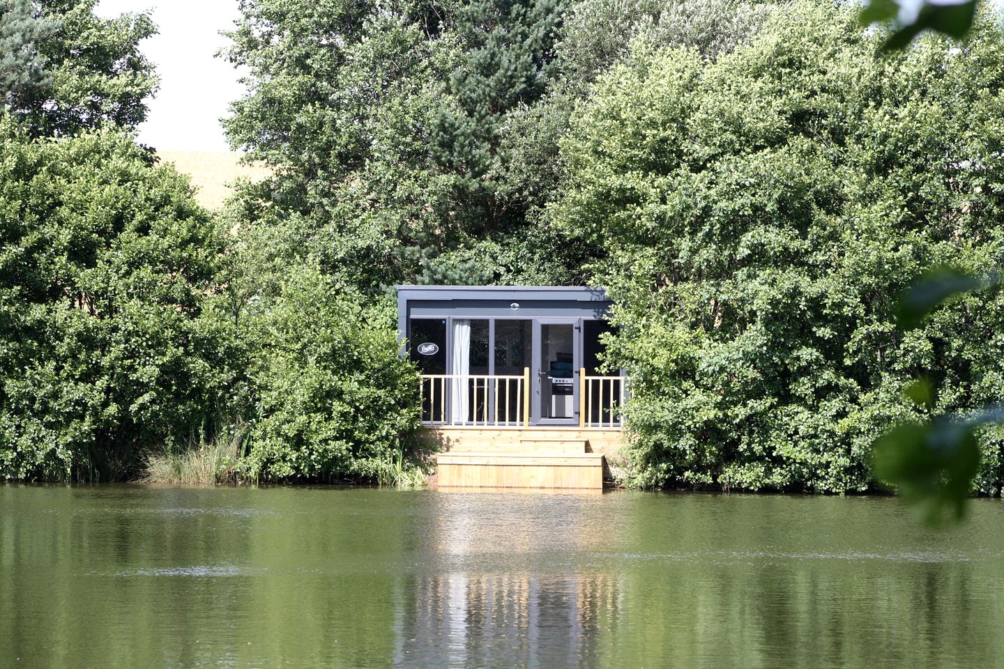 Stylish Lakeside Cabin with Private Hot Tub in South Wales, United Kingdom