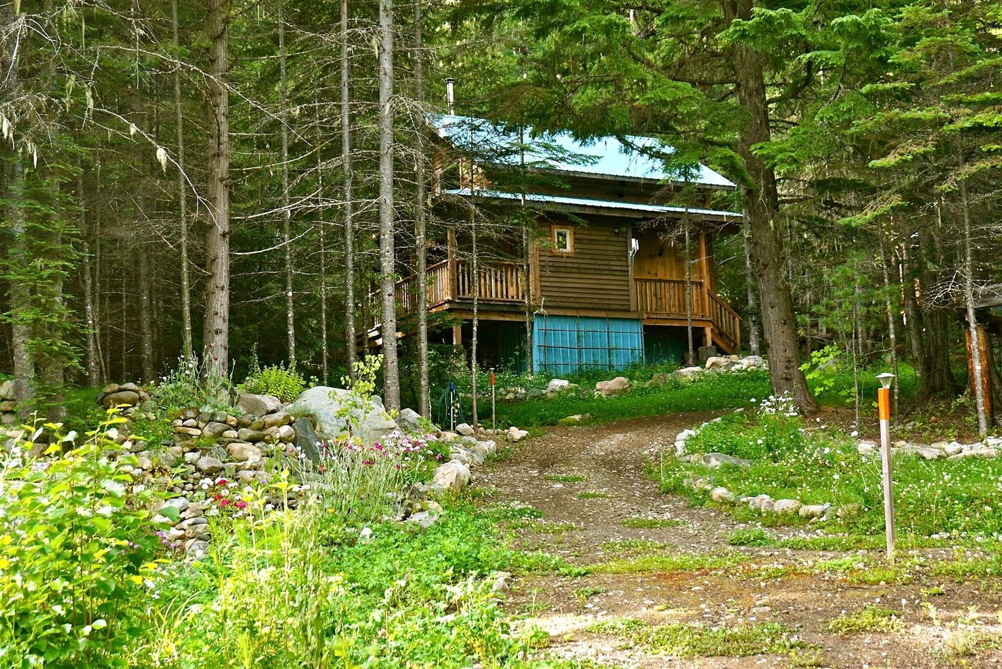 Vintage Canadian-Themed Cabin Nestled next to a Mountain Creek near Nelson, British Columbia