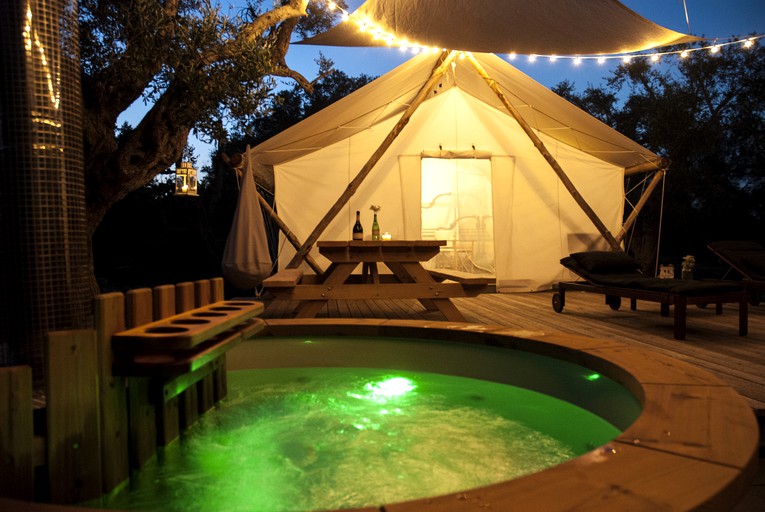 Fairy lights and hot tub with one of the best luxury glamping tents in Puglia, Italy