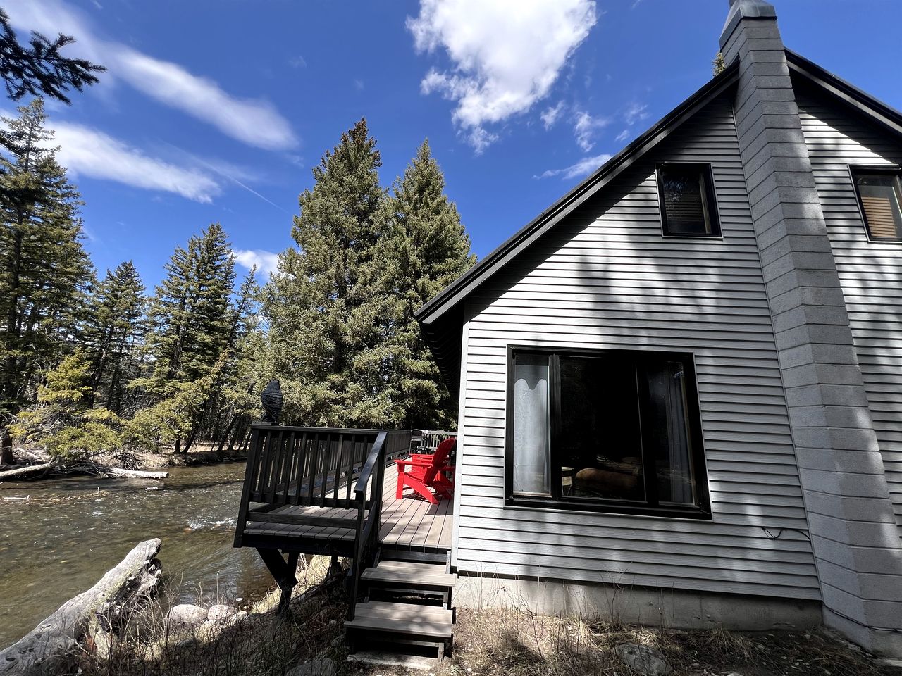 Charming Riverside Cabin with Deck Overlooking Madison River near Three Dollar Bridge in McAllister, Montana