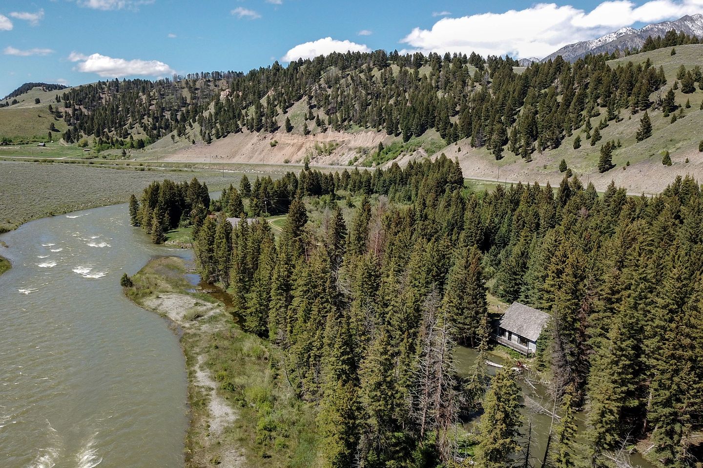 Charming Riverside Cabin with Deck Overlooking Madison River near Three Dollar Bridge in McAllister, Montana