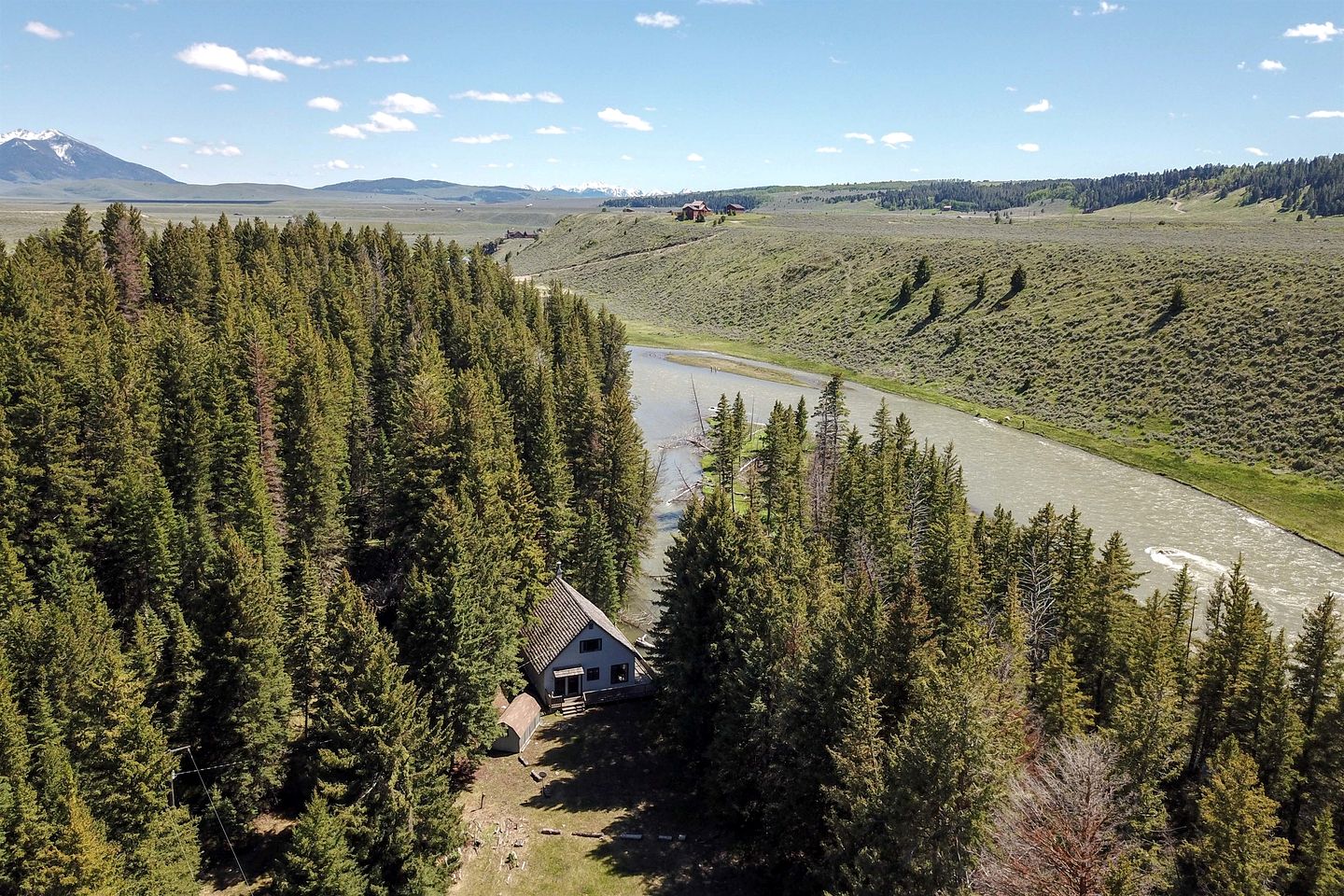 Charming Riverside Cabin with Deck Overlooking Madison River near Three Dollar Bridge in McAllister, Montana