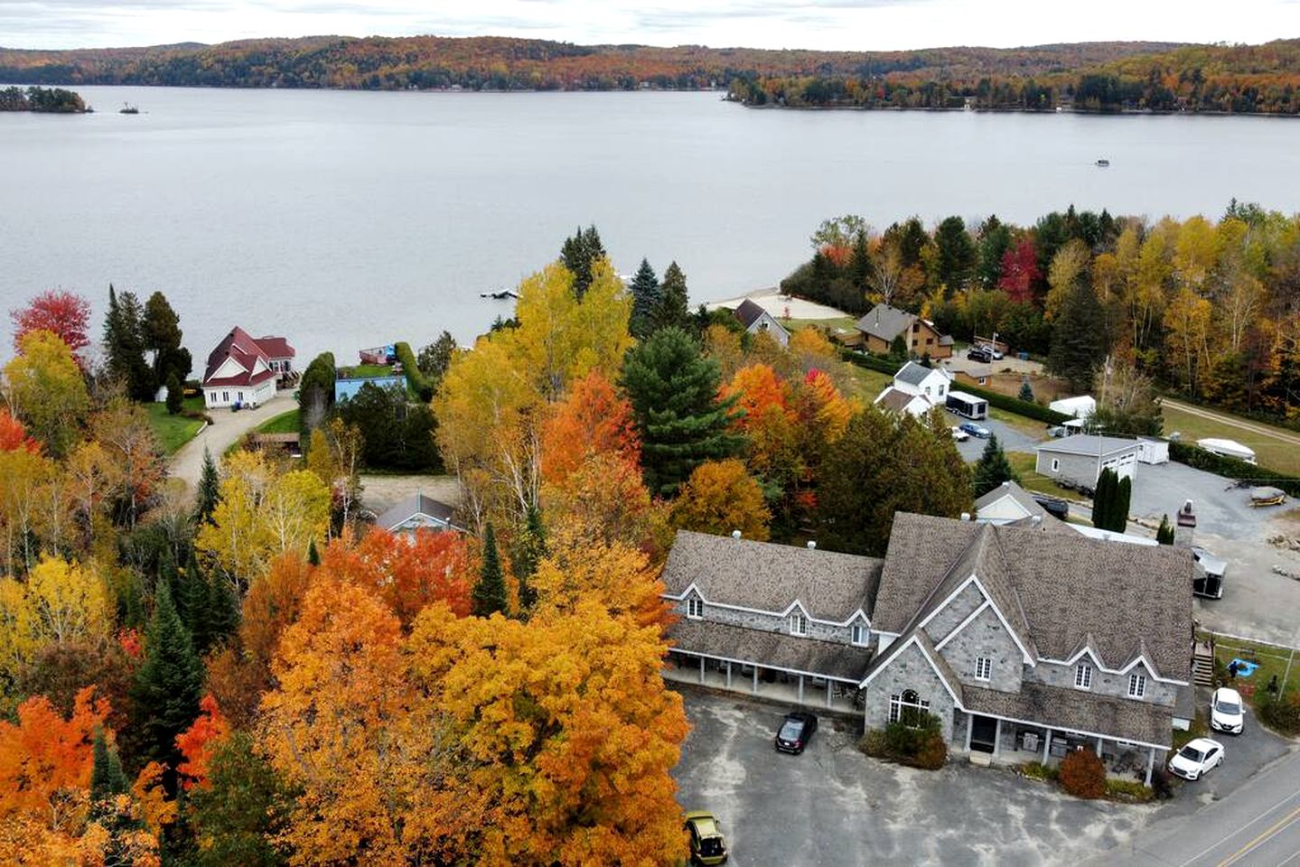 Enormous Lakefront Villa with Interior Pool, Game Room and Gym Space in Lac des Plages, Quebec