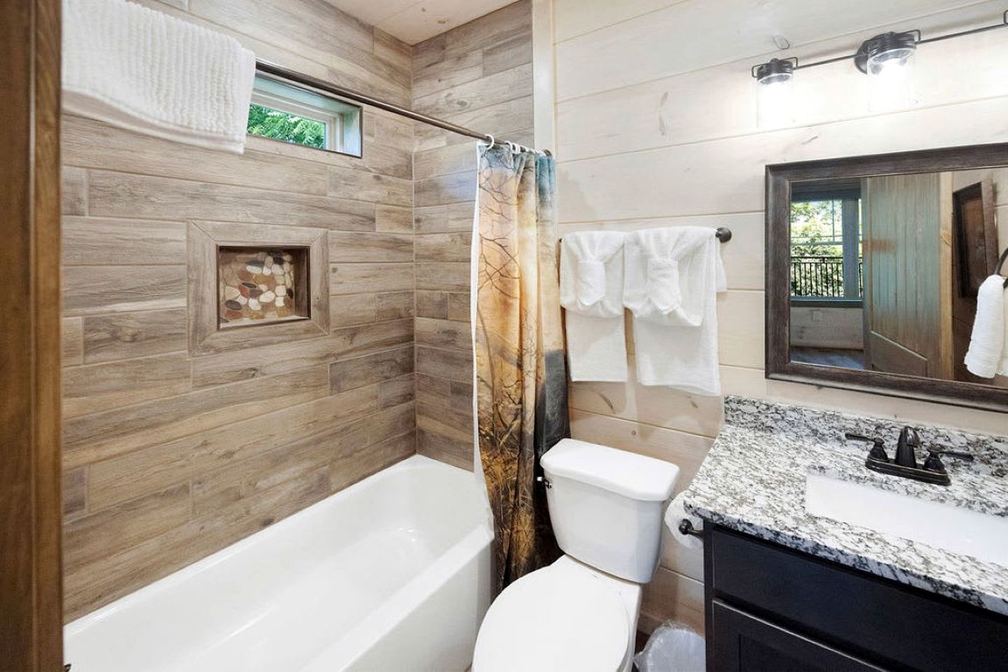 Modern Luxury Cabin with Hot Tub near Winfield Dunn Pkwy in Sevierville, TN