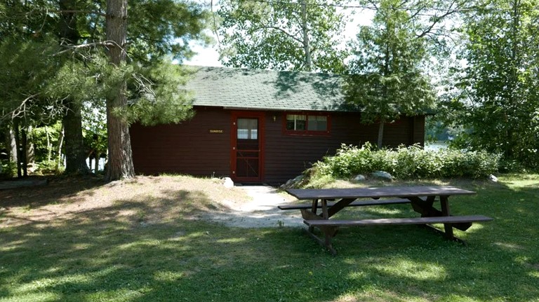 Serene Lakefront Cabin with Picture-Window Fishing Beside Covered Boathouse in Orr, Minnesota