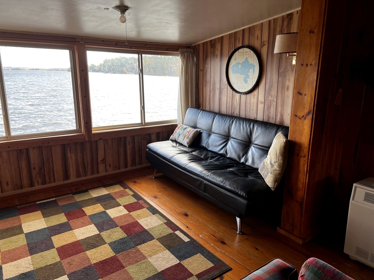 Serene Lakefront Cabin with Picture-Window Fishing Beside Covered Boathouse in Orr, Minnesota