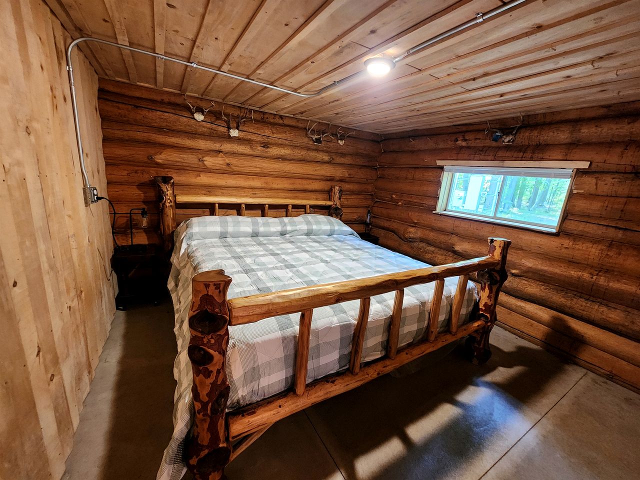 Secluded Rustic Cabins with Private Pond & Trails near ORV Routes in White Cloud, Michigan