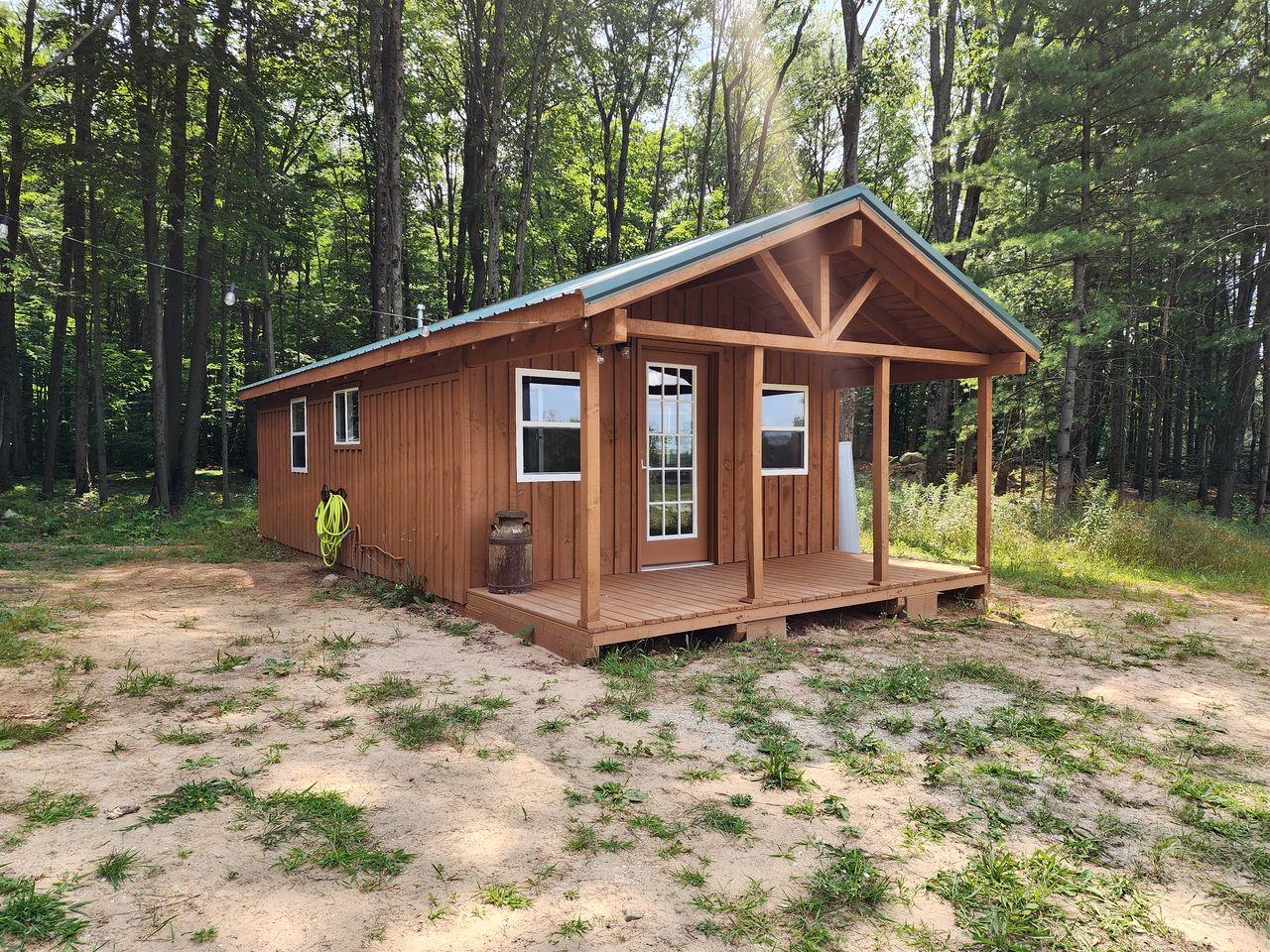 Secluded Rustic Cabins with Private Pond & Trails near ORV Routes in White Cloud, Michigan