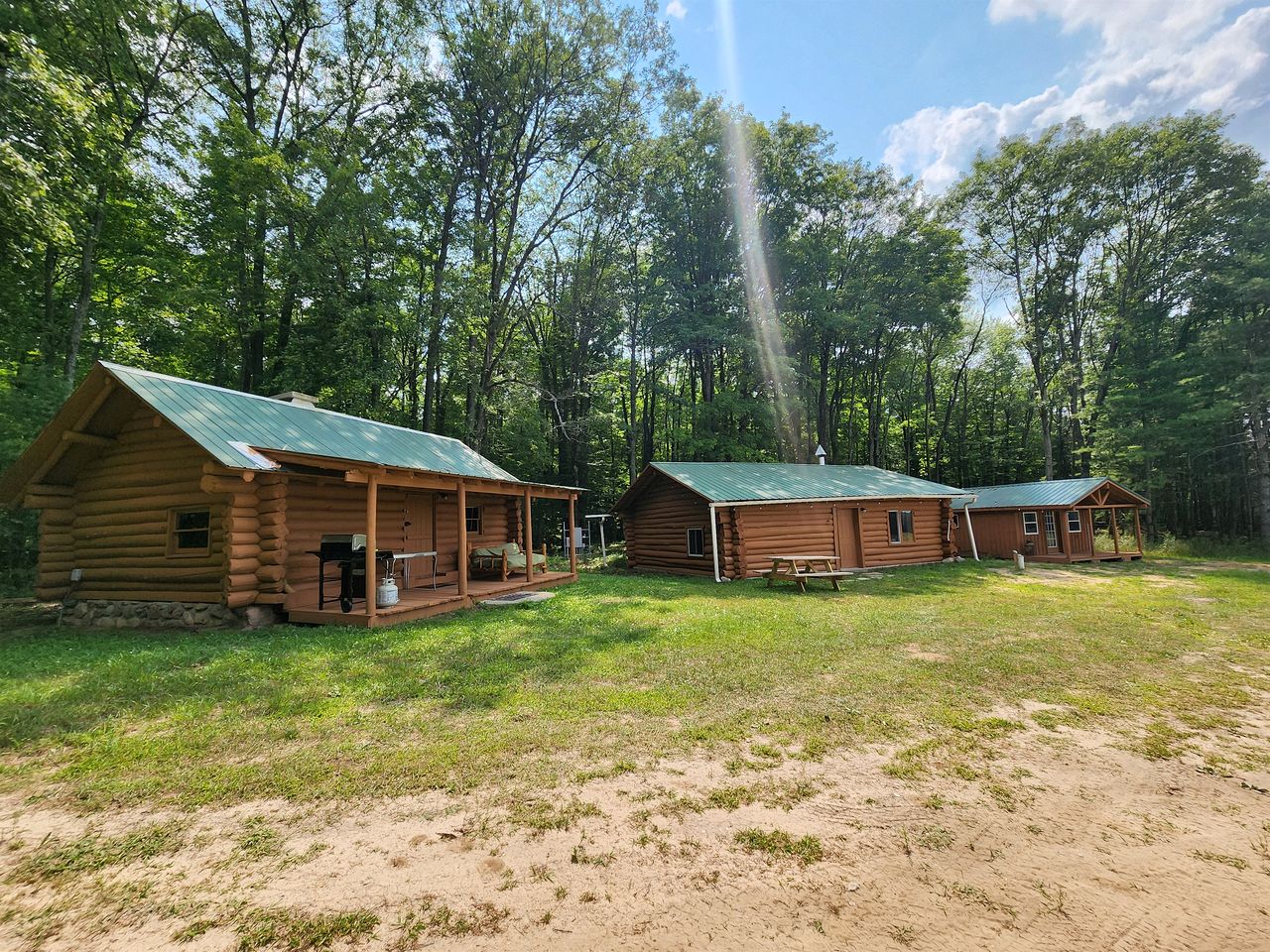 Secluded Rustic Cabins with Private Pond & Trails near ORV Routes in White Cloud, Michigan