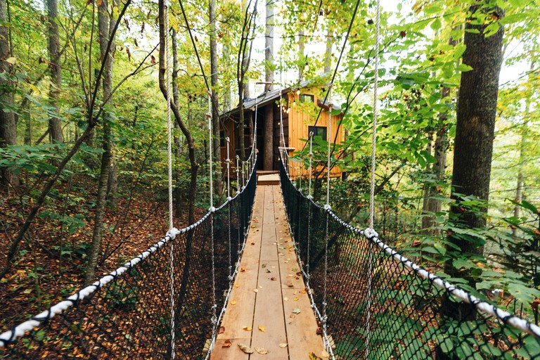Magical Treehouse Stay with Creekside Sauna Experience in Zirconia, North Carolina
