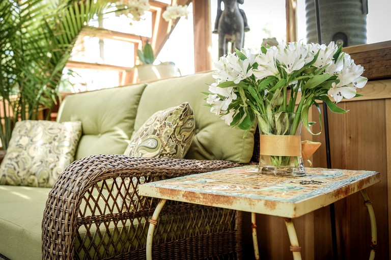 Fresh flowers next to living room sofa in top Oregon vacation rental