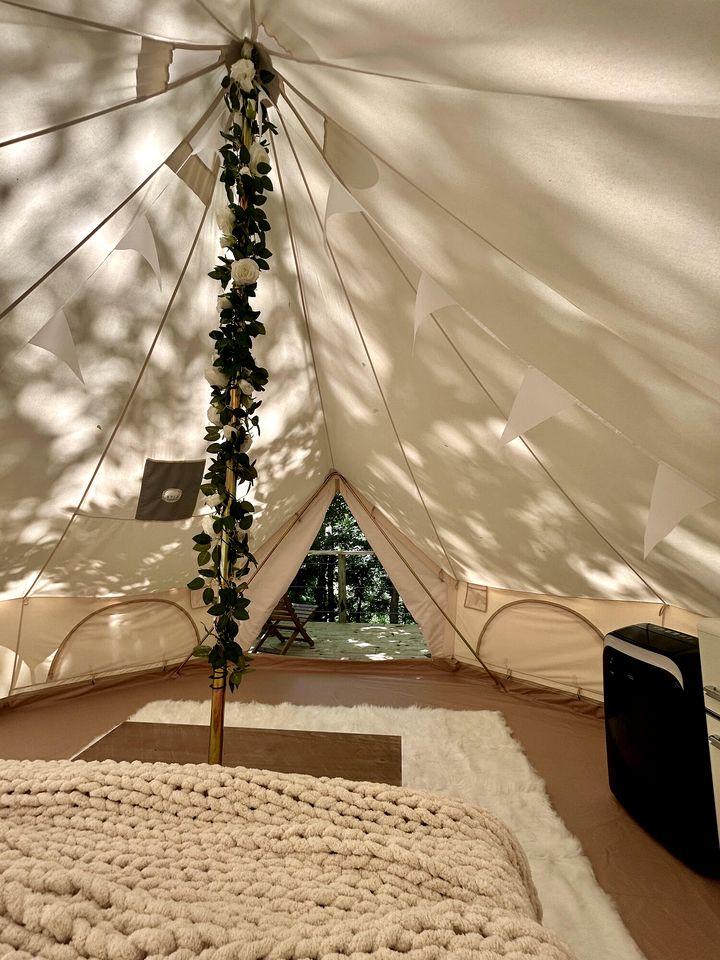 Peaceful Glamping Tents with Elevated Decks, Cozy Fire Pit, and Secluded Forest Views Near Gentry, AR