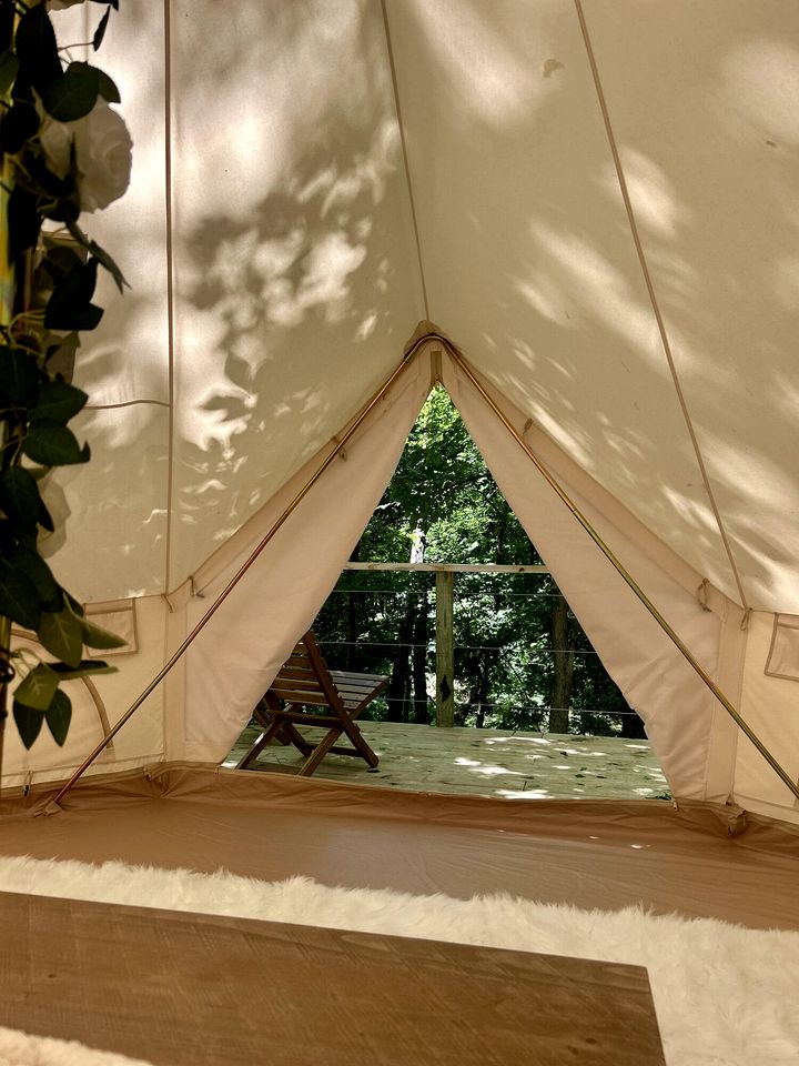 Peaceful Glamping Tents with Elevated Decks, Cozy Fire Pit, and Secluded Forest Views Near Gentry, AR
