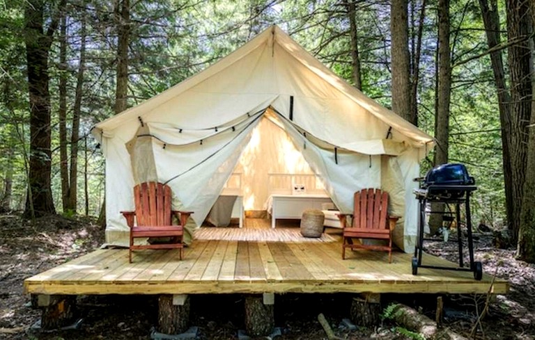 Comfortable Tent Retreat with Lounge Chairs, Fire Pit, Grill & Thoughtful Amenities in Broadalbin, New York