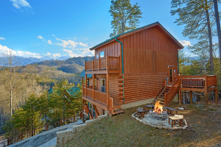 This Pigeon Forge vacation cabin comes with a hot tub and is great for glamping in Tennessee