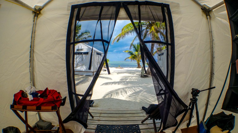 Inside of a safari tent on the beach in Stann Creek, Belize.