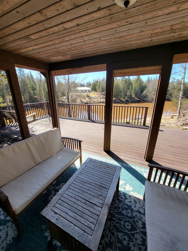 Riverfront Cabin Incredible for Outdoor Enthusiasts with Kayaks in Hessel, Michigan