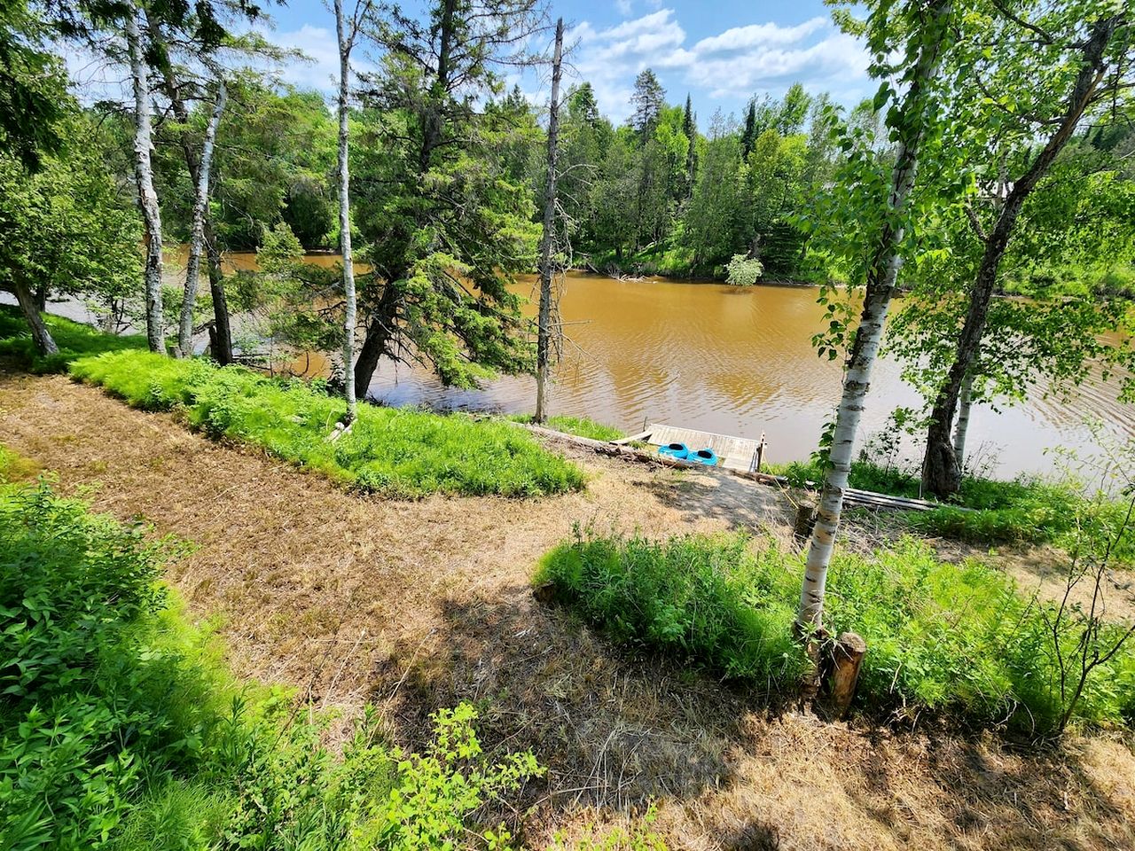 Riverfront Cabin Incredible for Outdoor Enthusiasts with Kayaks in Hessel, Michigan