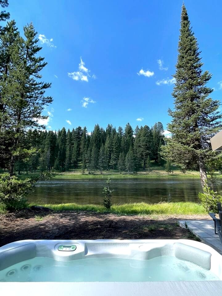 Charming Riverfront Cabin with Hot Tub and Dock Access Near Scenic Trails in Island Park, Idaho