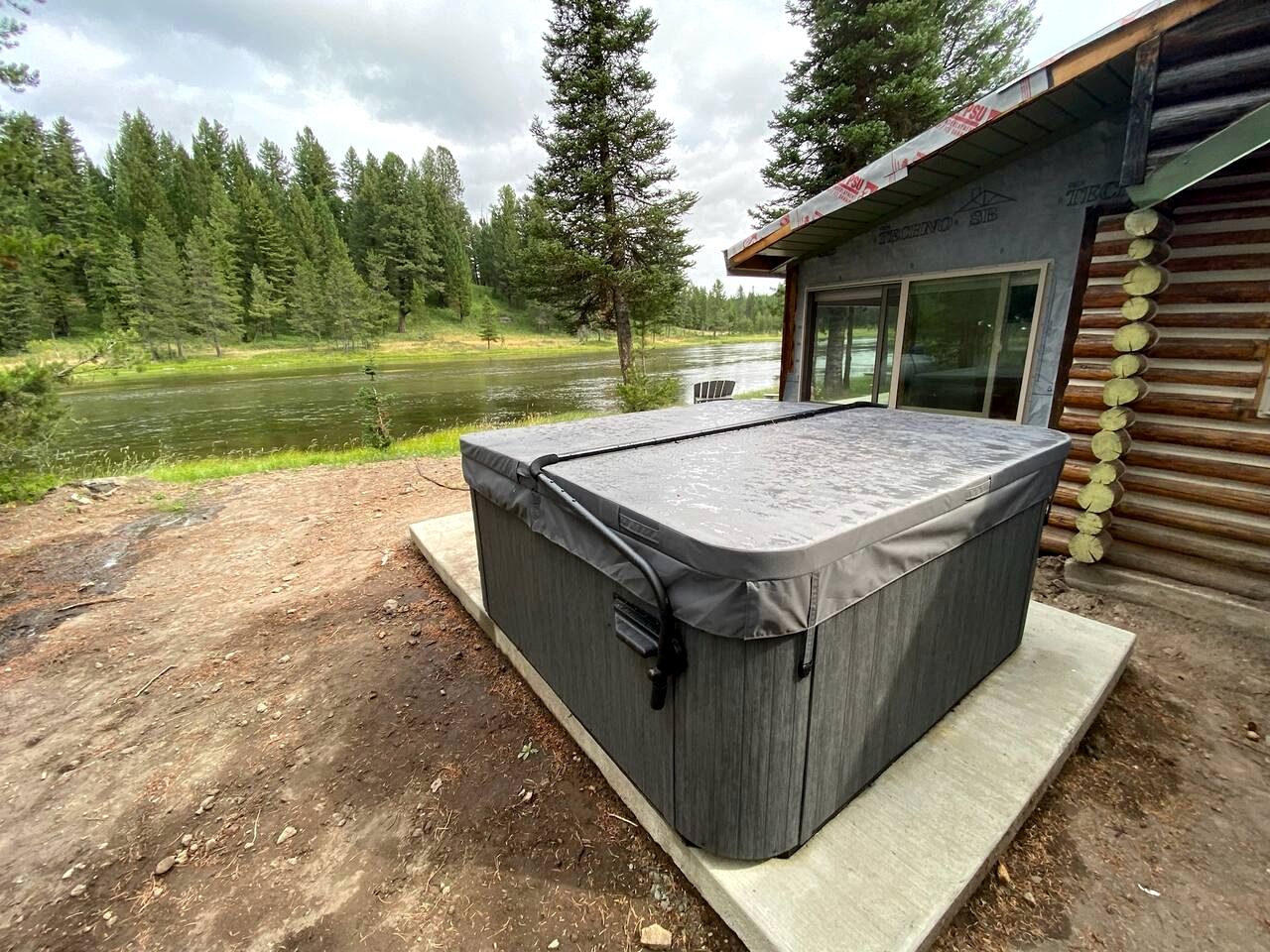 Charming Riverfront Cabin with Hot Tub and Dock Access Near Scenic Trails in Island Park, Idaho