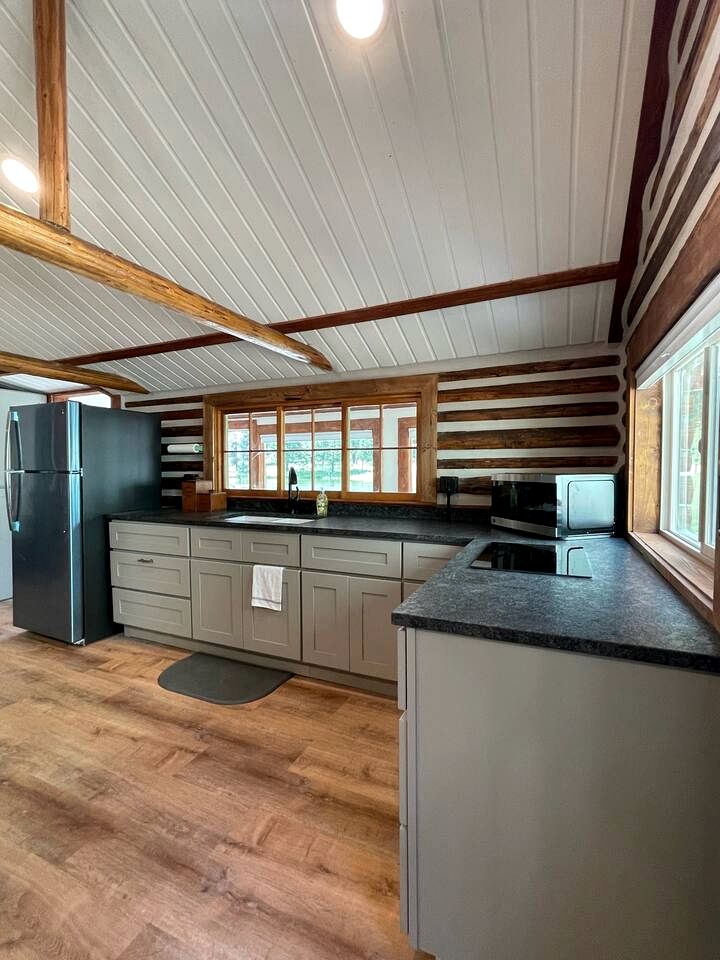 Charming Riverfront Cabin with Hot Tub and Dock Access Near Scenic Trails in Island Park, Idaho