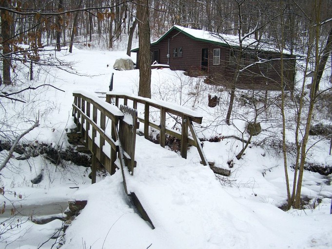 Log cabin covered in snow for a witner vacation in Grafton, Illinois