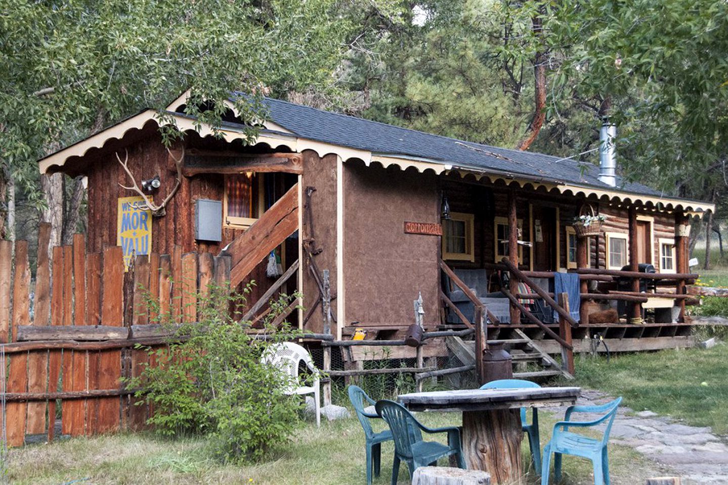 Rustic Log Cabin Set Within Mountains in Colorado