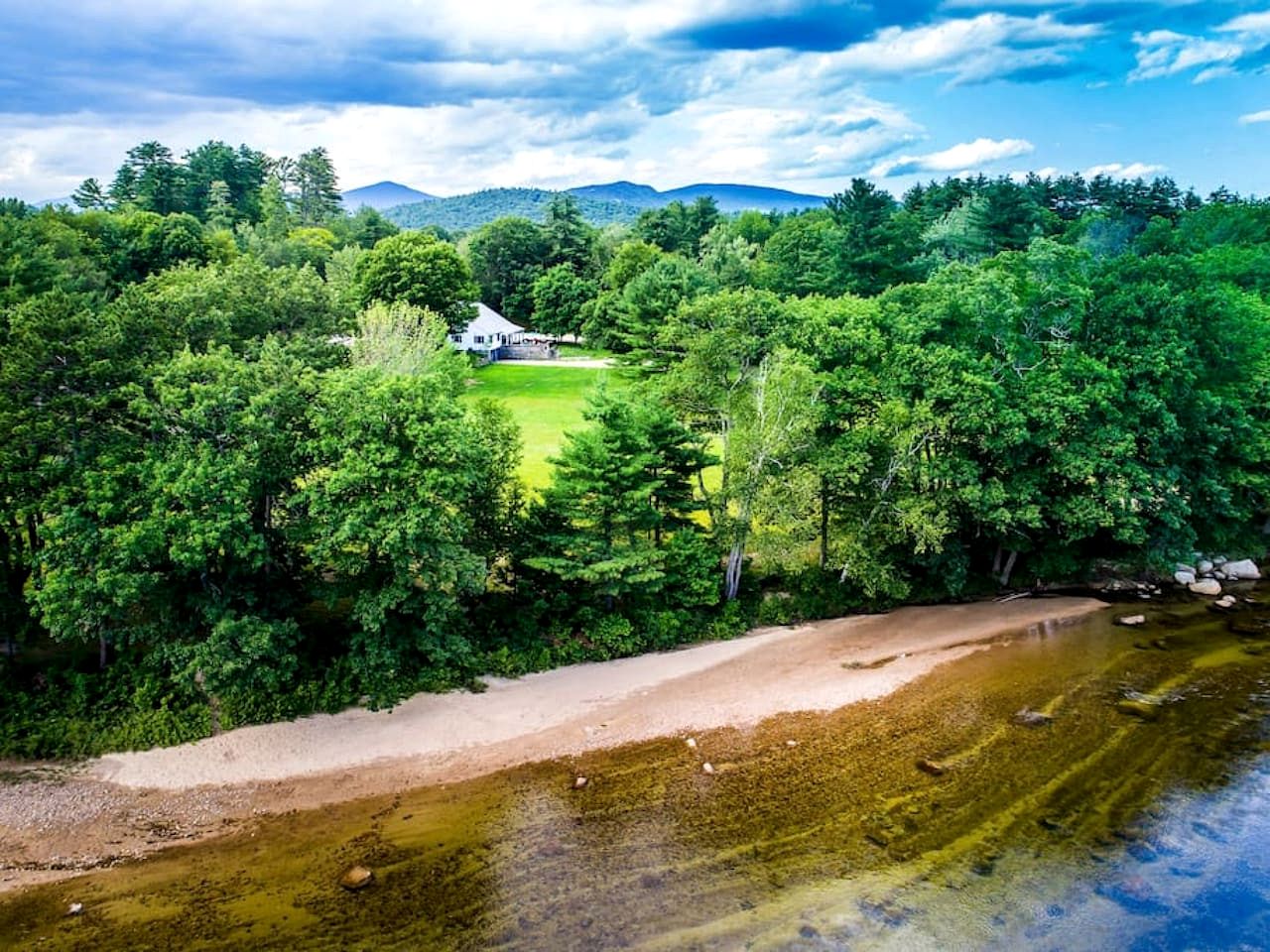 Secluded Group Retreat with Hot Tub, Riverfront & Huge Yard in Conway, New Hampshire