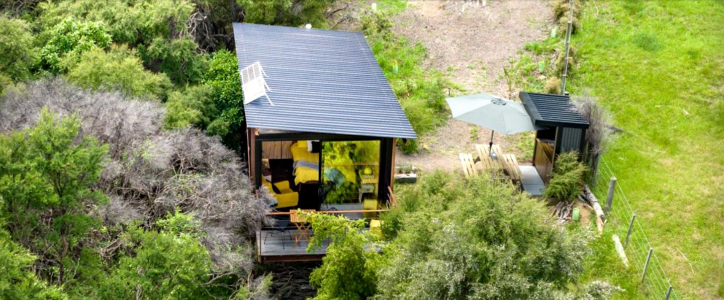 Gorgeous Romantic Tiny Hut Nestled Among the Towering Trees in NZ
