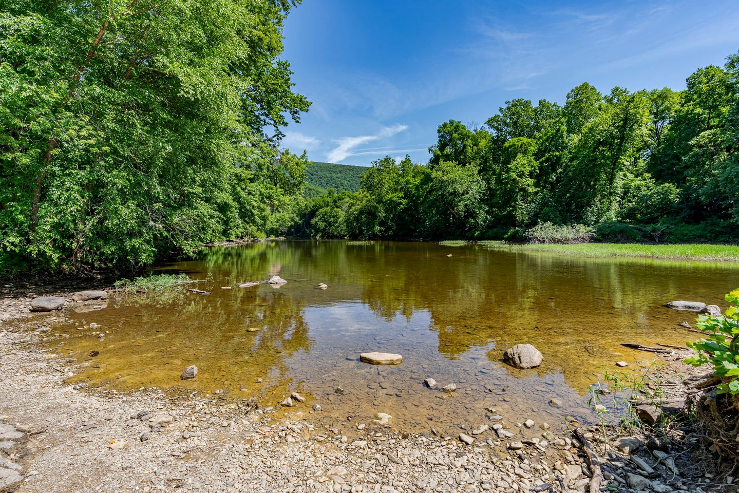River Cabin with Hot Tub, Fire Pit, Screened Porch and Plenty of Outdoor Activities to Keep Your Group Busy in Great Cacapon, WV