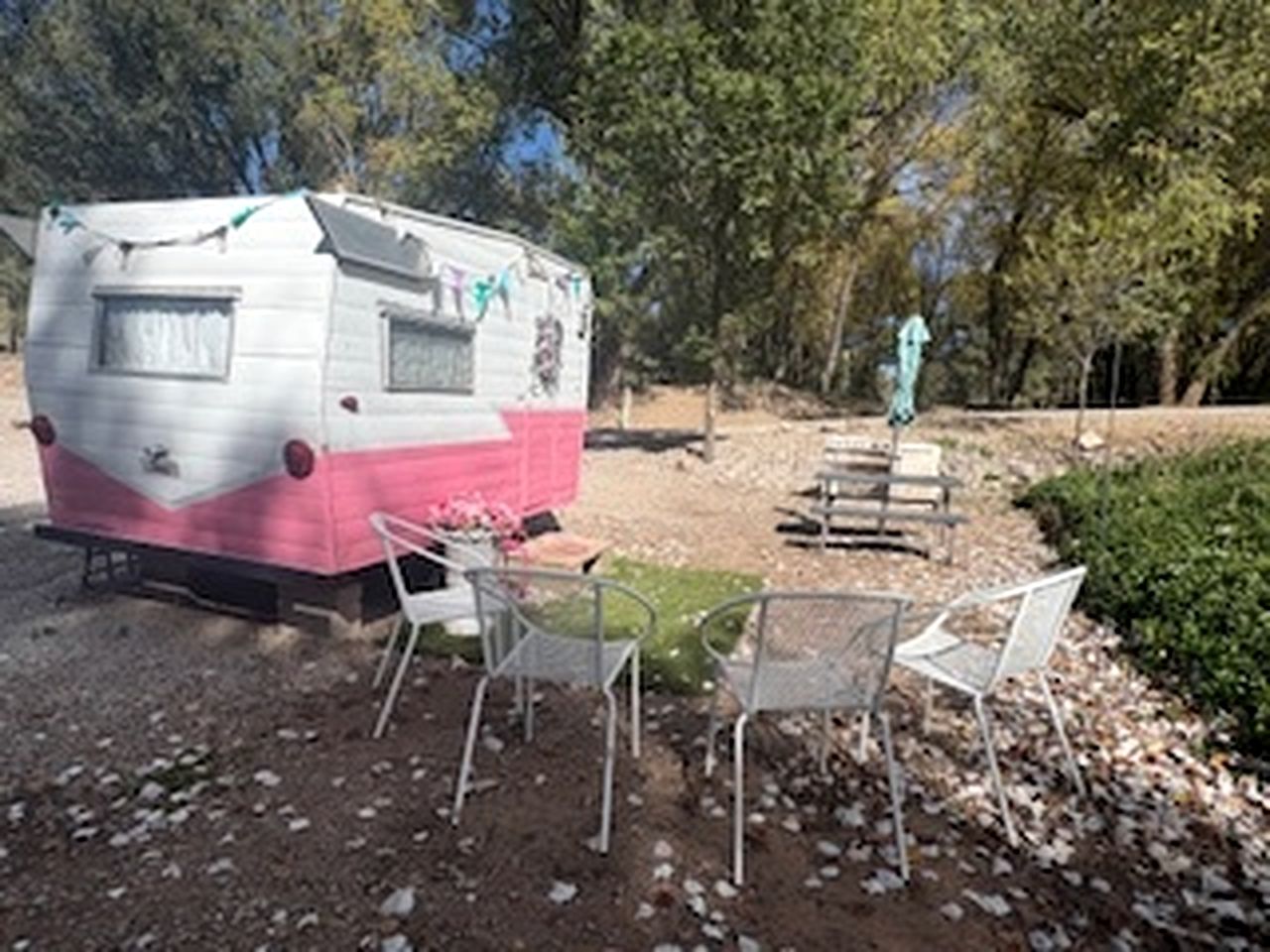 Charming Vintage Shasta Camper with Riverside Glamping Charm Near Pavilion Food Truck Scene in Mayhill, New Mexico