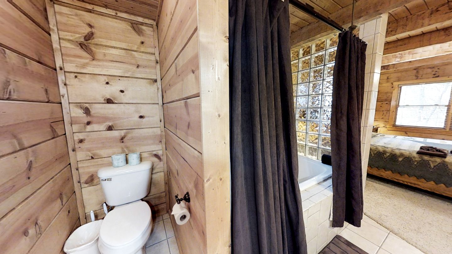 Rustic Family Cabin with Hot Tub, Pool Table, and Arcade near Smoky Mountains in Sevierville, Tennessee