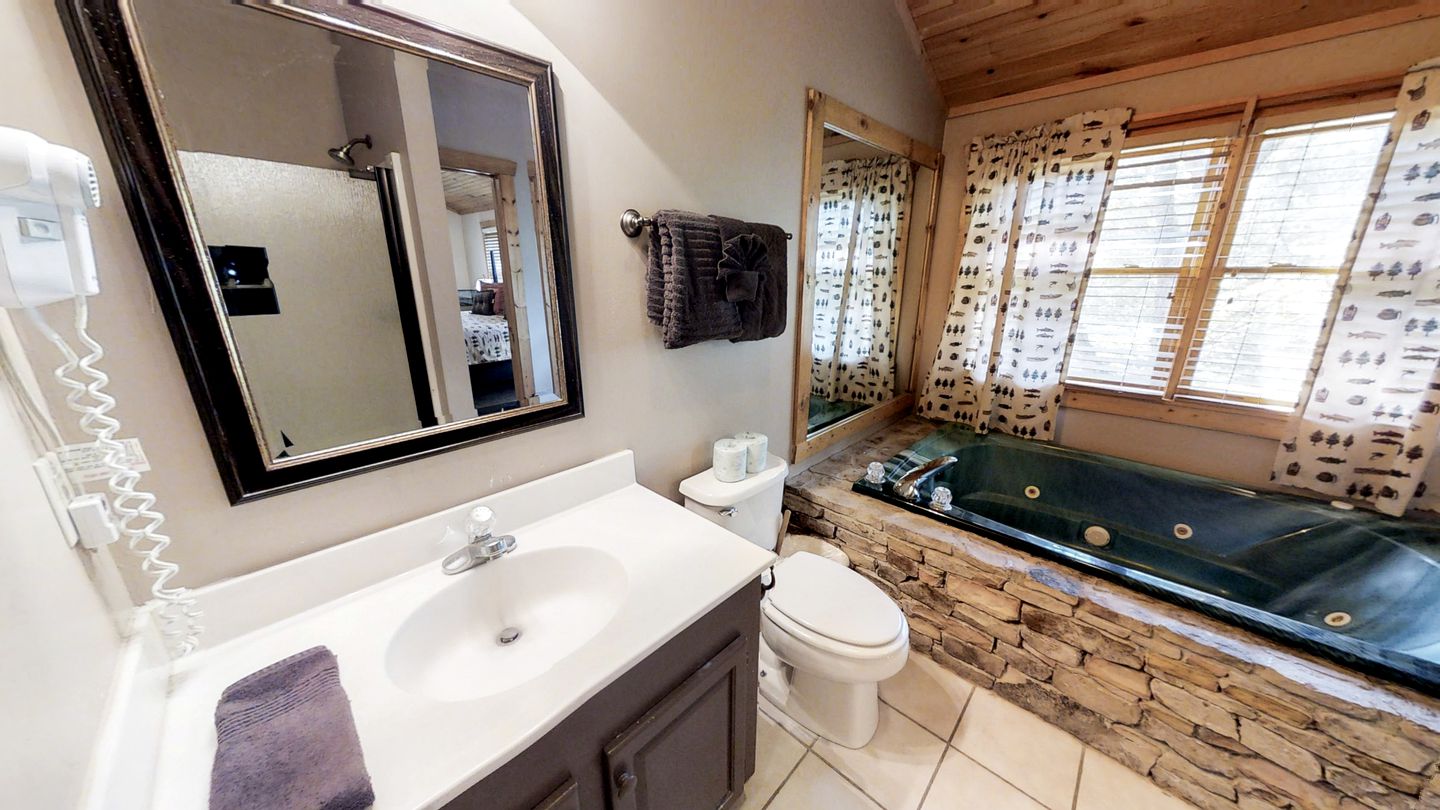 Rustic Family Cabin with Hot Tub, Pool Table, and Arcade near Smoky Mountains in Sevierville, Tennessee