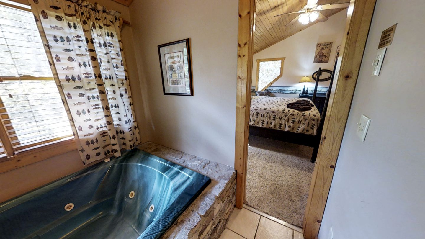Rustic Family Cabin with Hot Tub, Pool Table, and Arcade near Smoky Mountains in Sevierville, Tennessee