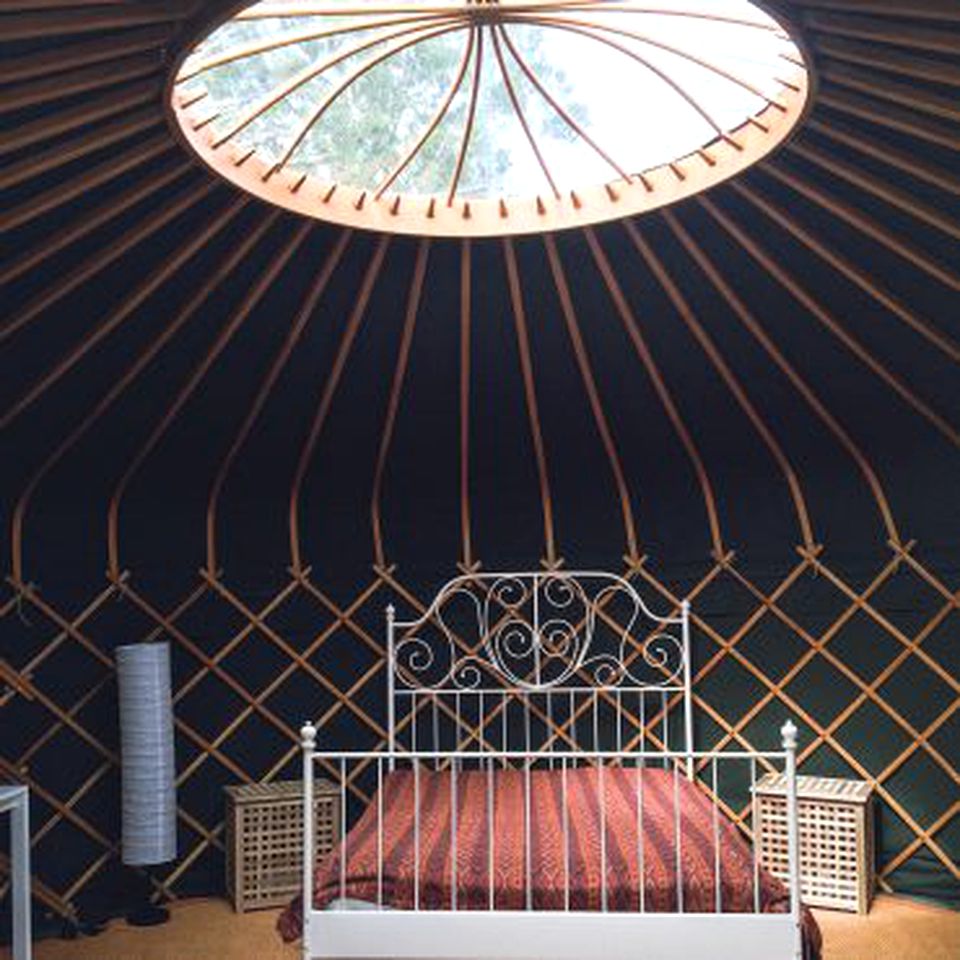 Stylish Yurt Rental with Wood-Burning Stove for Glamping in Somerset, England